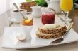 Breakfast with soft-boiled egg and slices of oatmeal bread