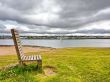 Wooden bench on a river