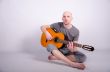 Nice bald guy with a guitar