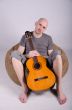 Nice bald guy with a guitar