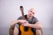 Nice bald guy with a guitar