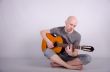 Nice bald guy with a guitar