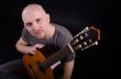 Nice bald guy with a guitar