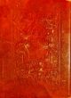 Old red leather texture with decorative frame.