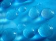 Drops of water in blue