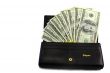 Dollar banknotes in the wallet black