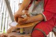hands of a potter, creating an earthen jar on the circle 