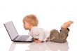 Young boy looking at a laptop