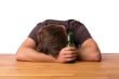 Man sleeping on a table with beer