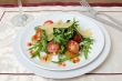 salad of arugula and cherry tomatoes with parmesan sauce