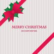 Christmas background with holly berry leaves on dark green background
