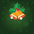 Christmas background with holly berry leaves on dark green background