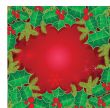 Christmas background with holly berry leaves on dark green background
