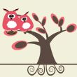 Two cute owls on the tree branch