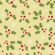Christmas background with holly berry leaves on dark green background