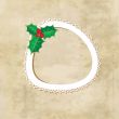 Christmas background with holly berry leaves on dark green background