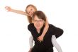 Man giving piggyback ride to a little girl