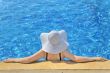 Woman with white hat relaxing 