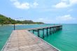 Wooden footbridge over the water near the beach 