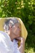 Aged woman sleeping on lounger