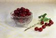 Cherries in a crystal vase on the table