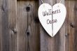 Wooden fence and wellness signboard