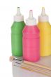 Bottles of paint and pencils