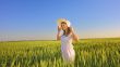 beautiful girl with hat in the field