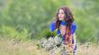 girl with bouquet  in field
