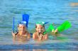 children on beach with snorkles
