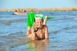 boy in the sea on a beach