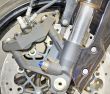 Closeup detail of a motorcycle`s front wheel 