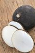 Black radish on a wooden board