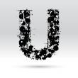 Letter U formed by inkblots