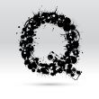 Letter Q formed by inkblots