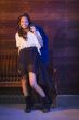 Mixed Race Young Adult Woman Portrait Against Wooden Wall