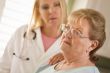 Senior Adult Woman Being Consoled by Female Doctor or Nurse
