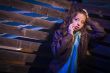 Frightened Pretty Young Woman in Dark Walkway at Night