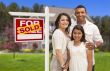 Hispanic Family in Front of Their New Home and Sign