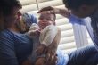 Mixed Race Couple Enjoying Their Newborn Son