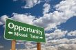 Opportunity Missed and Taken Green Road Sign and Clouds