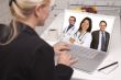 Woman In Kitchen Using Laptop, Online with Nurses or Doctors