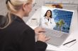 Woman In Kitchen Using Laptop - Online with Nurse or Doctor