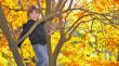 girl hanging from a tree