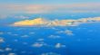aerial view of mountains and clouds on top
