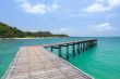 Wooden footbridge over the water near the beach 