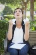 Upset Young Woman with Pencil and Crumpled Paper in Hands