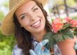 Young Adult Woman Wearing Hat Gardening Outdoors