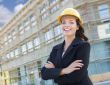 Portrait of Female Contractor Wearing Hard Hat at Construction S