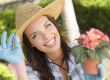 Young Adult Woman Wearing Hat Gardening Outdoors